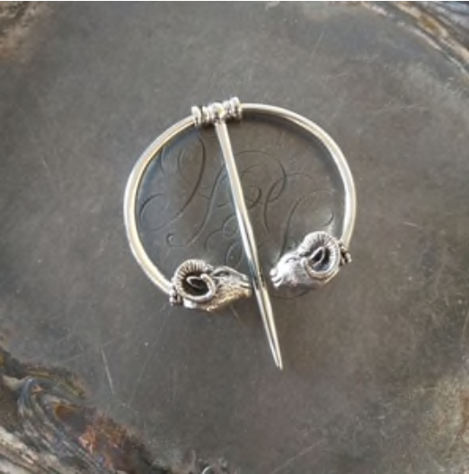 Ram Penannular Brooch